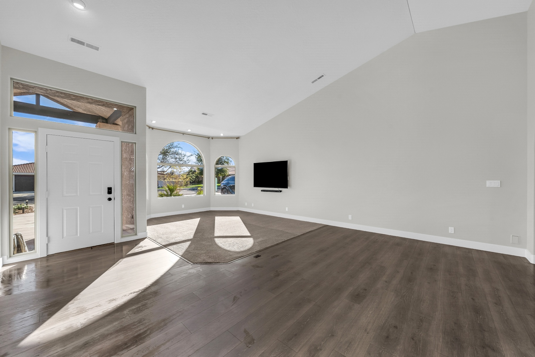 Vaulted great room in a home by Prestigious Home Builders